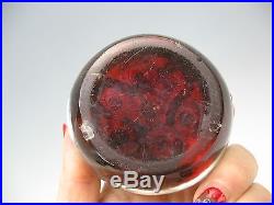 Antique BACCARAT paperweight animal canes red background