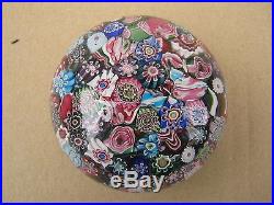 Magnificent scrambled millefiori paperweight withpolished concave base. Clichy