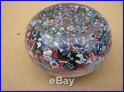 Magnificent scrambled millefiori paperweight withpolished concave base. Clichy
