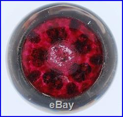 Paul Ysart Paperweight, Clusters of Millefiori on translucent cranberry