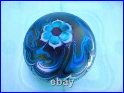 Signed Lundberg Studio Art Glass Iridescent Paperweight with a Floral Design